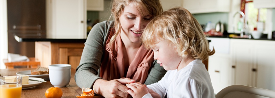 Mother and child having breakfast 